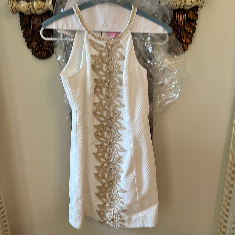 Lilly Pulitzer size 00 dress lined cream and gold. Runs small.